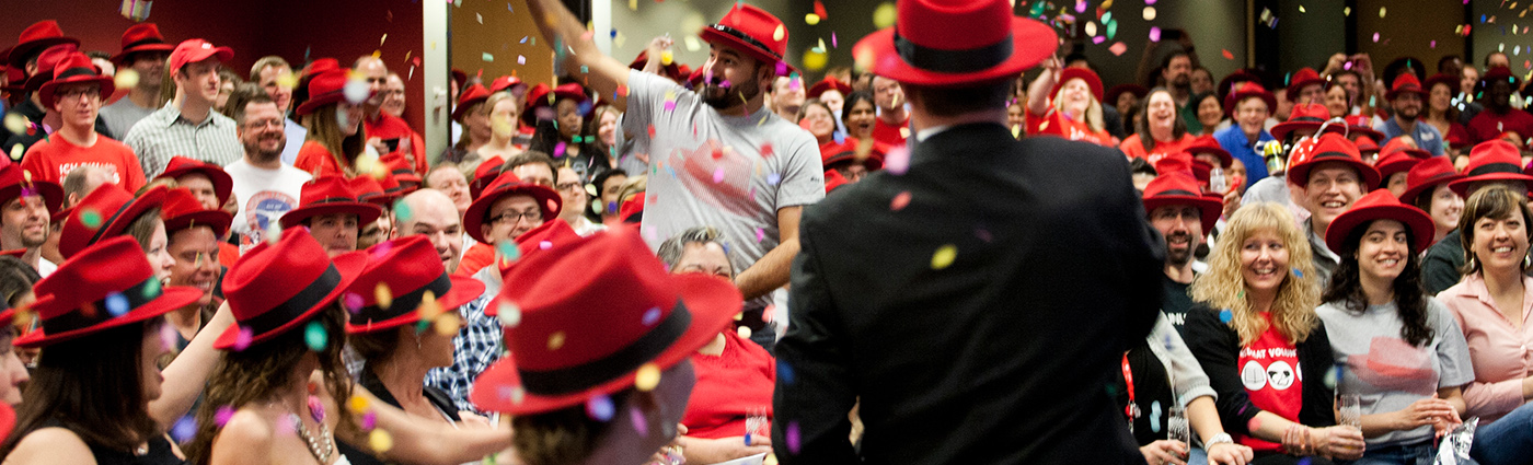 Red hatters celebrating with confetti